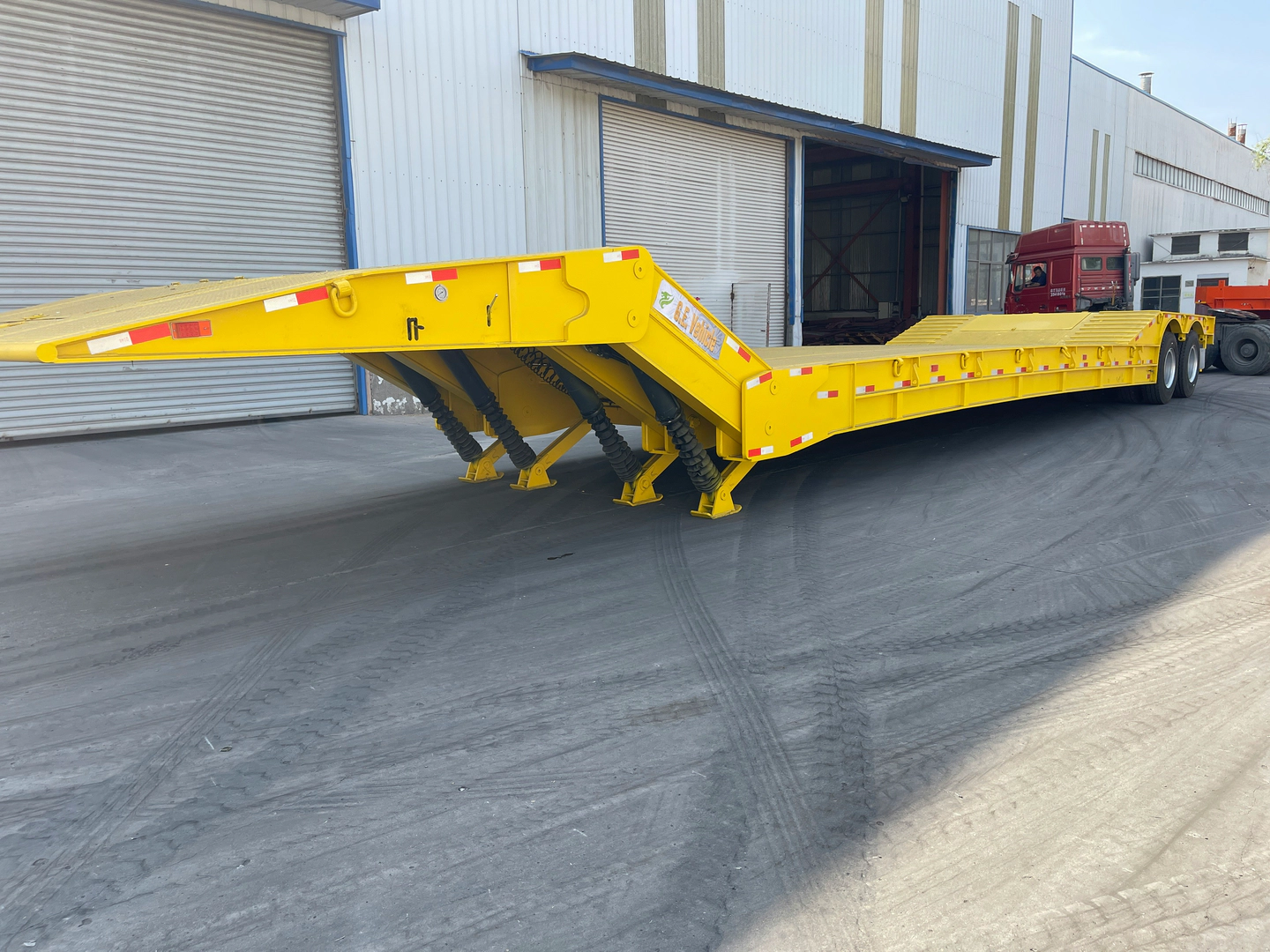 Photo of a yellow gooseneck trailer