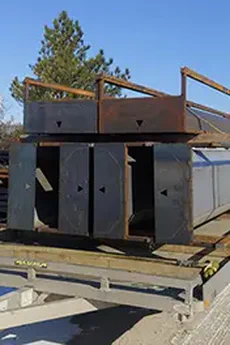 Photo of a semi truck hauling livestock equipment.